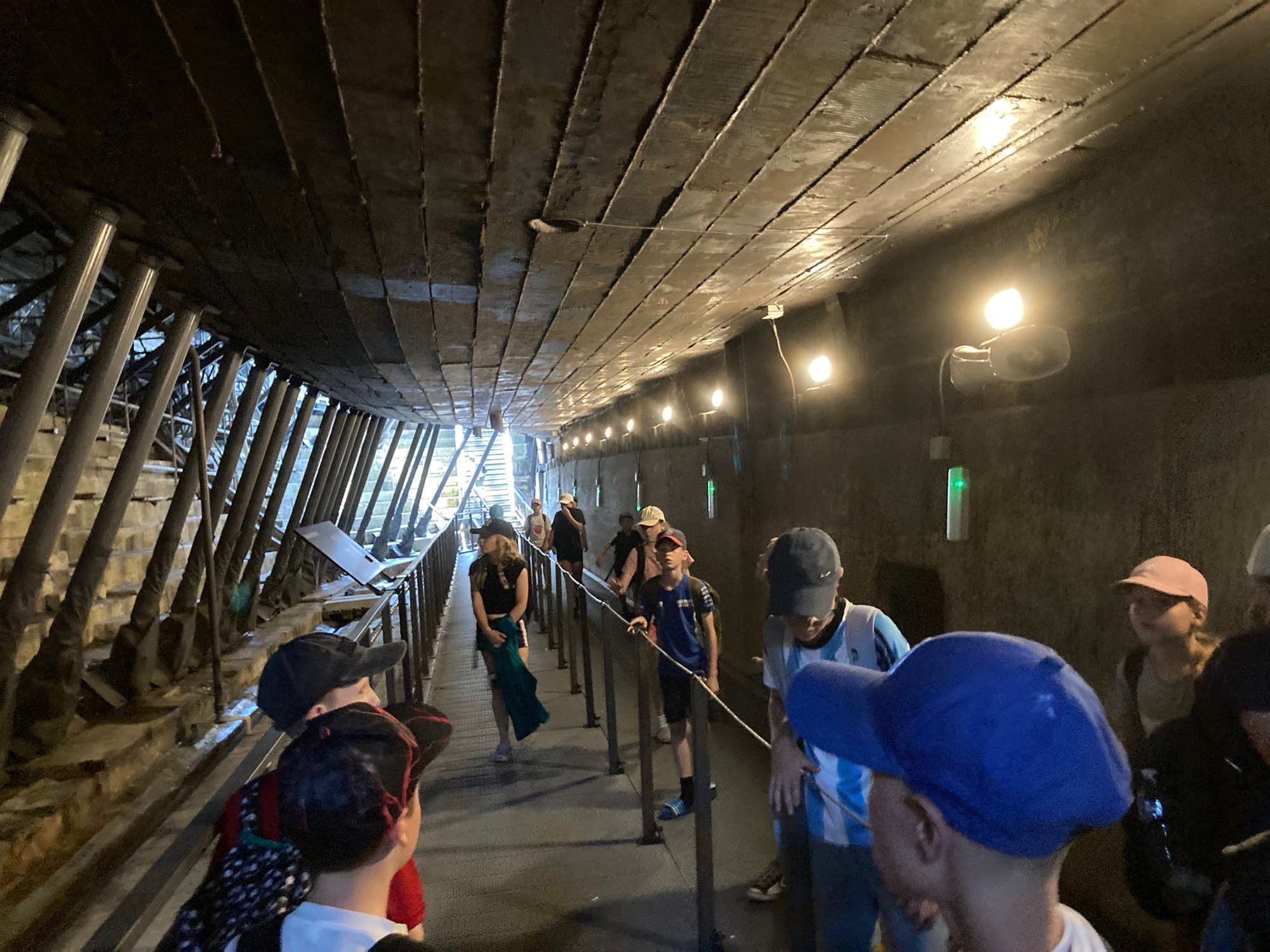 Walking beneath a ship's hull in the dry dock